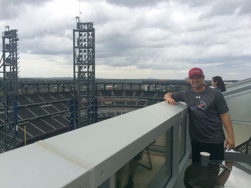 Trey Stewart on the terrace outside his 16th floor room that essentially overlooked SunTrust Park.
