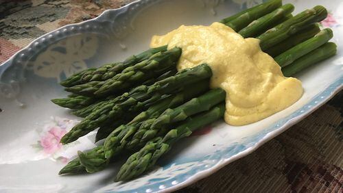 Green asparagus with classic hollandaise sauce. (Karen Kane/PIttsburgh Post-Gazette/TNS)