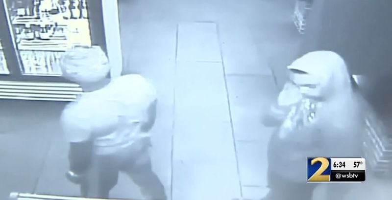 Surveillance video showed two of the men accused  of robbing multiple metro Atlanta businesses.