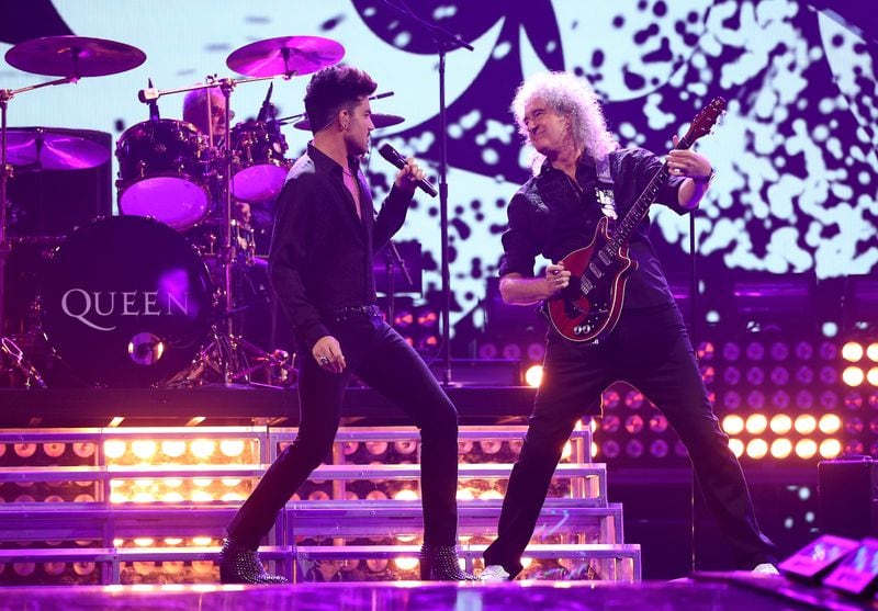 LAS VEGAS, NV - SEPTEMBER 20:  Adam Labert (L) and Brian May of Queen perform onstage during the iHeartRadio Music Festival at the MGM Grand Garden Arena on September 20, 2013 in Las Vegas, Nevada.  (Photo by Christopher Polk/Getty Images for Clear Channel)