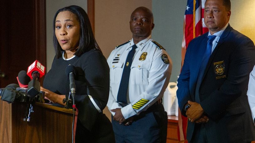 Fulton County District Attorney Fani Willis (L) talks at a press conference with Fulton County Sheriff Patrick Labat (R) and Atlanta Police Chief Rodney Bryant in Atlanta on Tuesday, May 10, 2022. (Steve Schaefer / steve.schaefer@ajc.com)