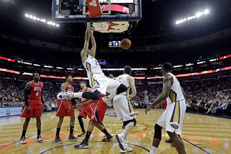 New Orleans Pelicans forward Anthony Davis (23) slam dunks in the second half of an NBA basketball game against the Atlanta Hawks in New Orleans, Monday, Feb. 2, 2015. The Pelicans won 115-100. (AP Photo/Gerald Herbert) The splendid Anthony Davis slams the door on the Hawks. (Gerald Herber/AP photo)