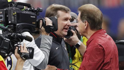 Georgia head coach Kirby Smart, left, speaks with Alabama head coach Nick Saban before the 2018 Southeastern Conference championship at Mercedes-Benz Stadium on Saturday, Dec. 1, 2018, in Atlanta. (AP Photo/John Bazemore)