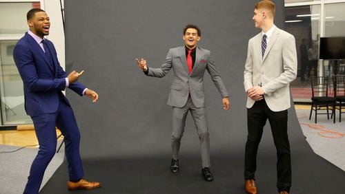 Atlanta Hawks NBA basketball team first-round draft picks from left; Omari Spellman, Trae Young and Kevin Huerter laugh after posing for photos following a news conference Monday, June 25, 2018, in Atlanta. (AP photo/John Bazemore)
