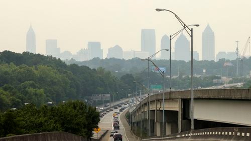 The Atlanta skyline is barely visible during poor air quality shown from the Buford connector off of I-85, Friday, June 30, 2023, in Atlanta. The Georgia Department of Natural Resources, Environmental Protection Division has issued a Code Orange Air Quality alert for Atlanta for Friday June 30th. Jason Getz / Jason.Getz@ajc.com)