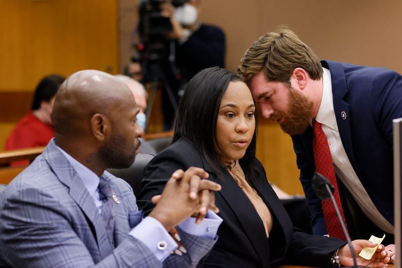 Fulton County District Attorney Fani Willis, center, confers with colleagues Nathan Wade, left, and Donald Wakeford, right, during a Jan. 24, 2023, hearing before Fulton Superior Court Judge Robert McBurney. (Miguel Martinez/Atlanta Journal-Constitution/TNS)