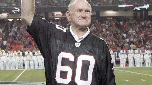"Mr. Falcon" Tommy Nobis acknowledges the fans' cheers during a 2009 ceremony. (AP Photo/John Amis, File)