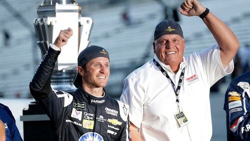 In this July 23, 2017, file photo, Kasey Kahne (5) celebrates with car owner Rick Hendrick after winning the NASCAR Brickyard 400 auto race at Indianapolis Motor Speedway in Indianapolis. Hendrick Motorsports and driver Kasey Kahne have agreed to part ways after six years. The team said in a statement Monday, Aug. 7, 2017, that Kahne has been released from the final year of his contract, allowing him to begin pursing a Monster Energy Cup ride for 2018.(AP Photo/AJ Mast, File)