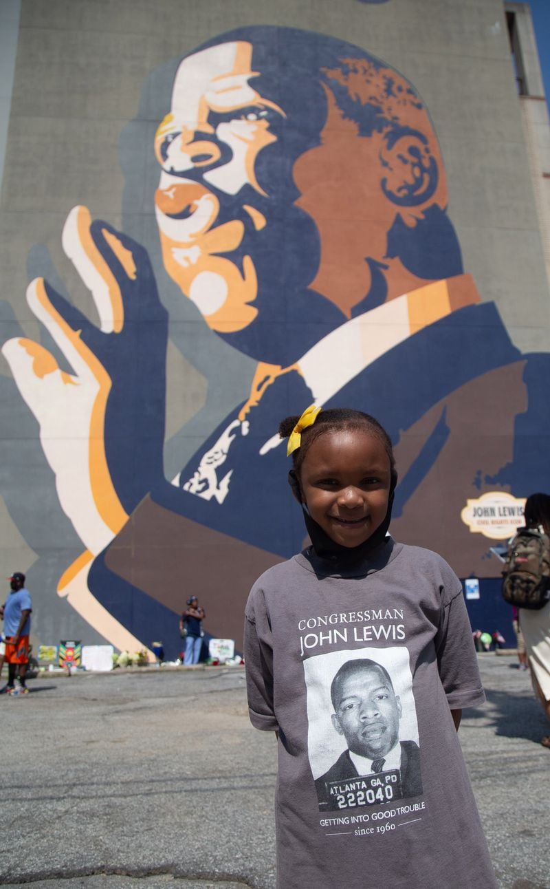  Dajha Smith, 5, shows off her John Lewis T-shirt she got from her grandmother while standing in front of the large John Lewis mural on Auburn Ave, July 18, 2020. STEVE SCHAEFER FOR THE ATLANTA JOURNAL-CONSTITUTION