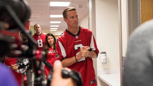 Former Atlanta Falcons quarterback Matt Ryan visits a patient at Children's Healthcare of Atlanta at Egleston in this Oct. 2018 file photo. (AJC file)