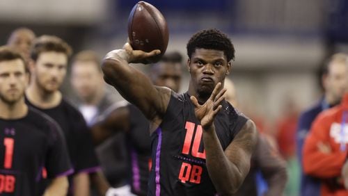 Louisville quarterback Lamar Jackson throws during a drill at the NFL football scouting combine, Saturday, March 3, 2018, in Indianapolis. CREDIT: Darron Cummings/Associated Press
