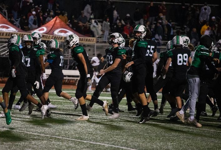 The Roswell varsity football team celebrate at the end of their game against Mill Creek on Friday, November 27, 2020, at Roswell High School in Roswell, Georgia. Roswell defeated Mill Creek 28-27. CHRISTINA MATACOTTA FOR THE ATLANTA JOURNAL-CONSTITUTION
