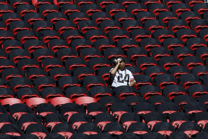 A fan enjoys the sun Sunday at Mercedes-Benz Stadium. The roof was open for the game between the Falcons and the Browns. (Miguel Martinez / miguel.martinezjimenez@ajc.com)