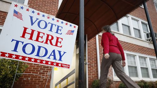 A person enters the Israel Baptist Church in Kirkwood during election day on Tuesday, December 6, 2022.
 Miguel Martinez / miguel.martinezjimenez@ajc.com