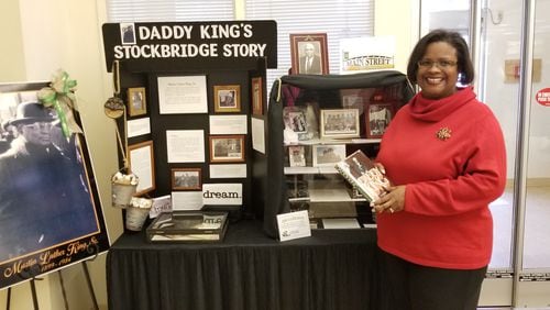 Stockbridge Main Street Manager Kira Harris-Braggs oversees a display on the Henry city's native son Martin Luther King Sr.