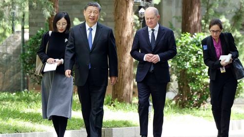 FILE - In this photo released by Xinhua News Agency, Chinese President Xi Jinping, second from left, and German Chancellor Olaf Scholz, second from right, walk together in Beijing, China, on Tuesday, April 16, 2024. Europe wants two things from China: First, a shift in its relatively pro-Russia position on the war in Ukraine. Second, a reduction in the trade imbalance. It’s not clear if it will get very far on either front. (Ding Haitao/Xinhua via AP, File)
