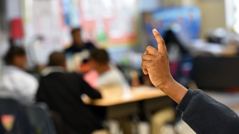 January 30, 2015 New Orleans, AL - A student raises his hand during his 5th grade science at KIPP Central City Academy in New Orleans, AL, on Friday, January 30, 2015. When Hurricane Katrina hit New Orleans, Louisiana decided to carry out a bold experiment - seize control of the city's worst schools, place them in a state-run "recovery" district and hand them over to charter operators. Ten years later, Georgia and a handful of other states want to replicate this approach, which has been heralded as a success among ed reformers. But is it really working? Fewer students are failing exams and grad rates up, but critics say it's far from a miracle. They point to tough discipline practices that bounce kids out of schools for minor infractions and fear the long-term implications of an all-charter approach. HYOSUB SHIN / HSHIN@AJC.COM New Orleans, La. - A student raises his hand during his 5th grade science class at KIPP Central City Academy in New Orleans. After Hurricane Katrina hit Louisiana decided to carry out a bold experiment – to seize control of the city's worst schools, place them in a state-run "recovery" district and hand them over to charter operators. Ten years later, Georgia and a handful of other states want to replicate this approach. Hyosub Shin, hshin@ajc.com