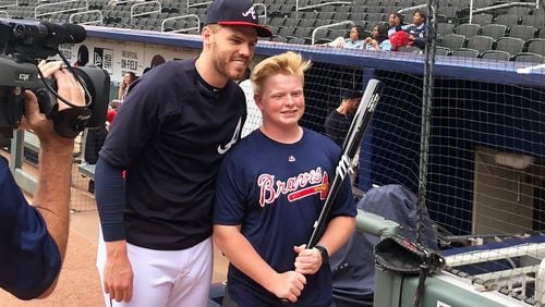 Braves first baseman Freddie Freeman met with Matt Klug before playing the Baltimore Orioles at SunTrust Park on Friday. (Photo by Tess DeMeyer/AJC)