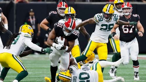 Falcons tight end Jonnu Smith (81) breaks the defensive line during the second half against the Green Bay Packers on Sunday, Sept. 17, 2023, at Mercedes-Benz Stadium in Atlanta. Miguel Martinz/miguel.martinezjimenez@ajc.com