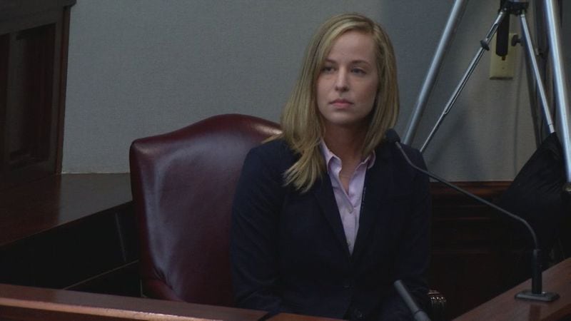 Jacqueline Piper answers questions while on the stand at Harris' murder trial at the Glynn County Courthouse in Brunswick, Ga., Monday, Oct. 4, 2016. Piper was one of the Cobb police officers who responded to the scene when Justin Ross Harris pulled over and found Cooper dead. (screen capture via WSBTV)