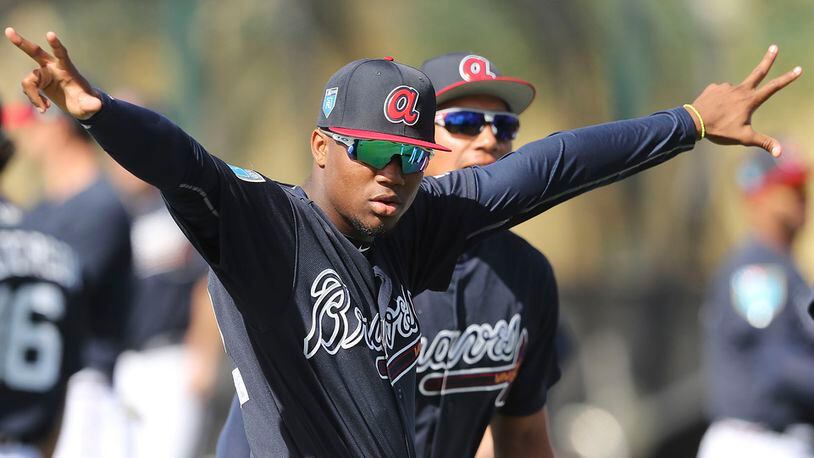 Atlanta Braves outfield prospect Ronald Acuna loosens up during spring training camp Tuesday, Feb. 20, 2018, in Lake Buena Vista, Fla.