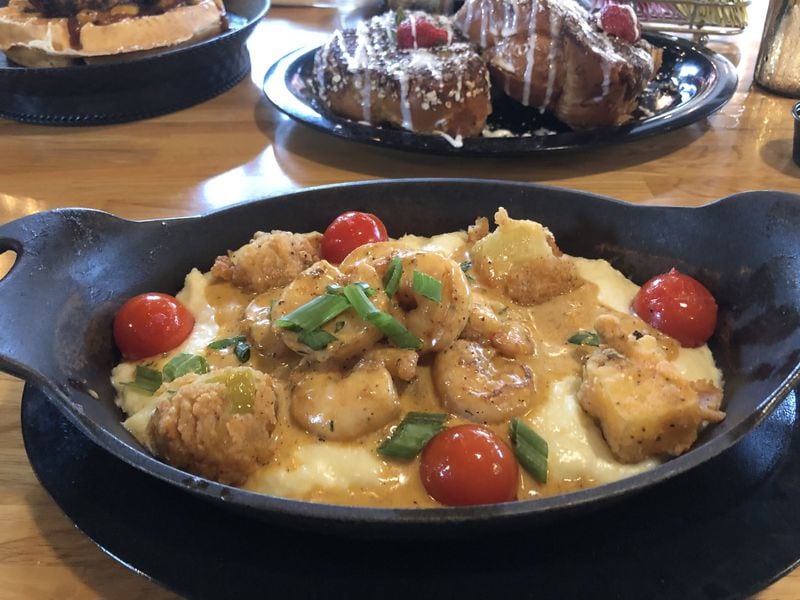 The shrimp and grits at the Real Milk & Honey has a creamy-spicy sauce. CONTRIBUTED BY WENDELL BROCK