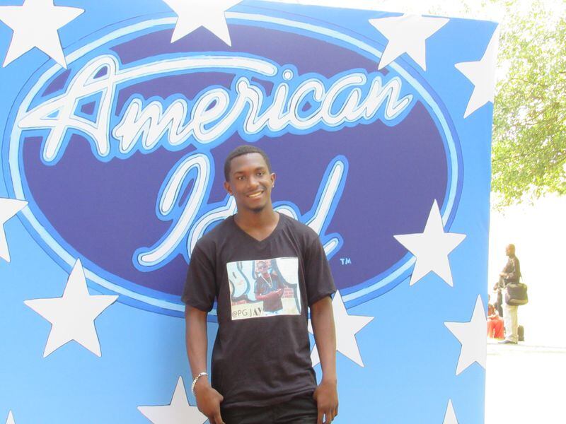  Jovaris Taylor didn't make the cut but after the 18 year old tried out, he took a photo in front of a big "Idol' sign for posterity. CREDIT: Rodney Ho/rho@ajc.com