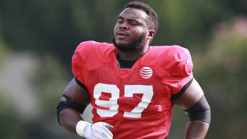 Atlanta Falcons defensive tackle Grady Jarrett loosens up during a NFL football training camp practice on Tuesday, August 7, 2018, in Flowery Branch.