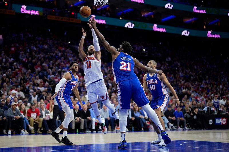 New York Knicks' Jalen Brunson (11) goes up for a shot against Philadelphia 76ers' Joel Embiid (21) during the first half of Game 3 in an NBA basketball first-round playoff series, Thursday, April 25, 2024, in Philadelphia. (AP Photo/Matt Slocum)