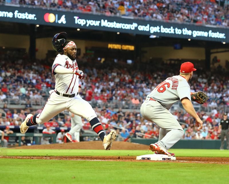 Braves outfielder Michael Harris beats the throw to St. Louis Cardinals first baseman Paul Goldschmidt for a single during the fourth inning in a MLB baseball game on Tuesday, July 5, 2022, in Atlanta.  “Curtis Compton / Curtis.Compton@ajc.com”
