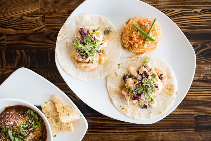Rise & Revelry fish tacos with black bean corn salsa, habanero aioli, and vegetable rice.