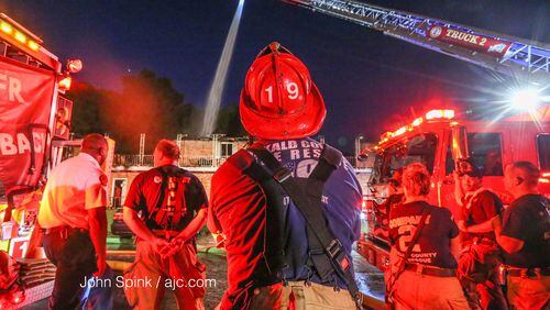 Crews fought a blaze that displaced 19 people in DeKalb County. JOHN SPINK / JSPINK@AJC.COM