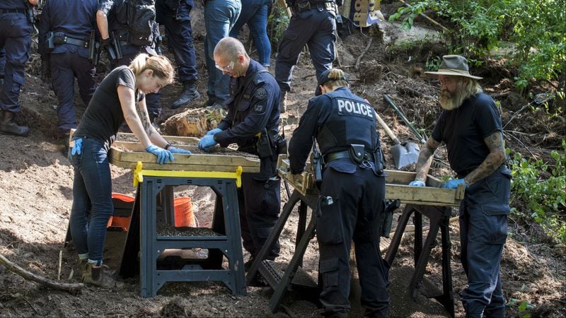 In this July 5, 2018, photo, members of the Toronto Police Service excavate a ravine behind a Mallory Crescent home connected to alleged serial killer Bruce McArthur. Toronto Inspector Hank Idsinga told reporters Friday, July 20, 2018, that the remains found during the nine-day search of the ravine earlier in the month have been positively identified as those of victim  Majeed “Hamid” Kayhan. Kayhan, 58, vanished in October 2012 from Toronto's Gay Village.