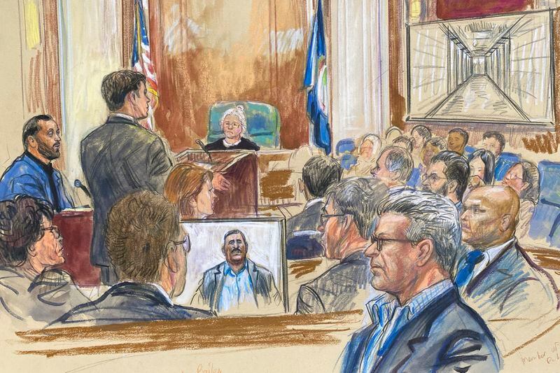 This artist sketch depicts Salah Al-Ejaili, foreground with glasses, a former Al-Jazeera journalist, before the U.S. District Court in Alexandria, Va., Tuesday, April 16, 2024. Al-Ejaili, a former detainee at the infamous Abu Ghraib prison, has described to jurors the type of abuse that is reminiscent of the scandal that erupted there 20 years ago: beatings, being stripped naked and threatened with dogs, stress positions meant to induce exhaustion and pain. (Dana Verkouteren via AP)