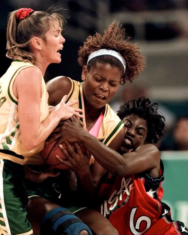 Ruthie Bolton (6) of the U.S. women's basketball team, Brazil's Alessandra Oliveria (center) and Hortencia Marcari Oliva (left) fight for the ball during first half of the gold medal basketball competition Sunay, Aug. 4, 1996, at the 1996 Summer Olympic Games in Atlanta. (Susan Ragan/AP)