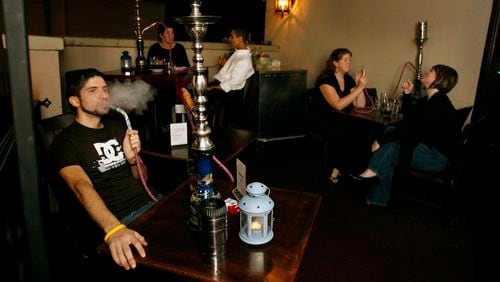 A hookah pipe is smoked at Ibiza Restaurant and Lounge on Peachtree Road in 2006 (Mikki K. Harris/AJC staff)