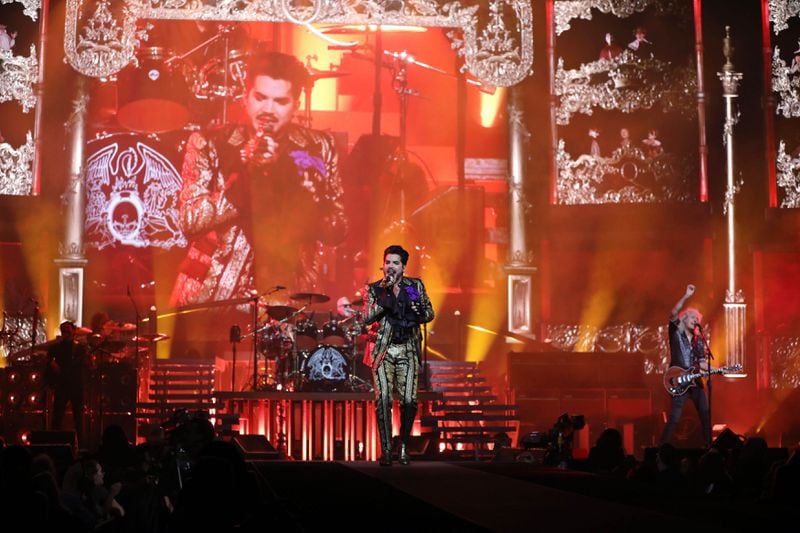 Queen + Adam Lambert features original members Brian May on guitar and Roger Taylor on drums.