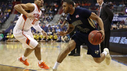 WASHINGTON, DC - MARCH 09: Adam Smith #2 of the Georgia Tech Yellow Jackets dribbles in front of Avry Holmes #12 of the Clemson Tigers during the first half in the second round of the 2016 ACC Basketball Tournament at Verizon Center on March 9, 2016 in Washington, DC.(Photo by Patrick Smith/Getty Images)