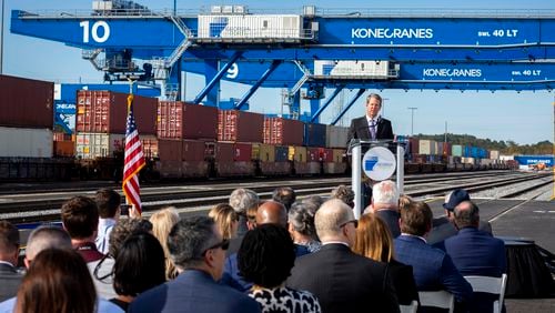 Gov. Brian Kemp speaking at event marking the opening of all 18 working tracks at the Georgia Port Authority's Mason Mega Rail Terminal at the Port of Savannah in November. The lines are meant to help handle the continued surge in cargo coming through the port. (AJC Photo/Stephen B. Morton)