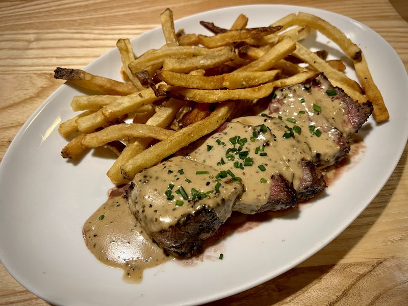 You'd expect the sister restaurant of a steakhouse to serve good steak frites, and you won't be disappointed at Mac's Raw Bar. Henri Hollis/henri.hollis@ajc.com