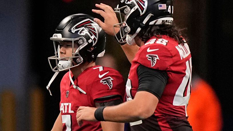 Falcons kicker Younghoe Koo (7) celebrates with long snapper Liam McCullough after Koo's field goal against the Bears earlier this season. (AP Photo/Brynn Anderson)