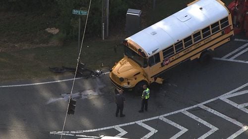 One person was hurt shortly before 3:30 p.m. Monday when a car collided with a school bus for children, officials said. (Credit: Channel 2 Action News)