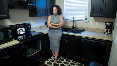 Jacqueline Atterberry in the kitchen of her Southwest Atlanta townhouse, which she had built in 2007. The housing bubble burst soon afterward, leaving her deeply ‘underwater.’ Atterberry hopes to be one of the 3,000 homeowners selected for the Underwater Georgia program, which would boost her equity. STEVE SCHAEFER / SPECIAL TO THE AJC