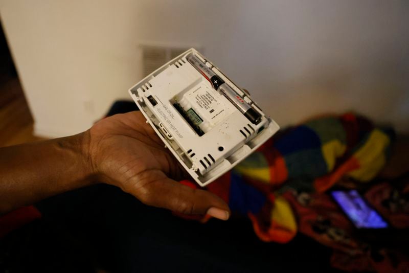 After tenant Danielle Russell's thermostat broke in June, temperatures inside her home rose higher than they were outside. It took more than a month for Pavilion Place maintenance workers to replace it. (Miguel Martinez/miguel.martinezjimenez@ajc.com)