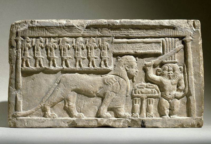 “Stela with the Gods Bes and Tutu” in limestone from 332-30 B.C. is featured in the Michael C. Carlos Museum exhibition “Divine Felines: Cats of Ancient Egypt.” CONTRIBUTED BY BROOKLYN MUSEUM