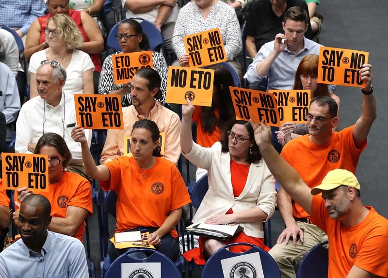 August 19, 2019 Marietta: Many area residents hold signs in opposition as Cobb officials and environmental regulators hold a town hall and community forum in the wake of reports that Cobb and Fulton have high levels of carcinogenic gas on Monday, August 19, 2019, in Marietta. A user and emitter of the gas, Sterigenics, which sterilizes medical equipment, operates in the area.  Curtis Compton/ccompton@ajc.com