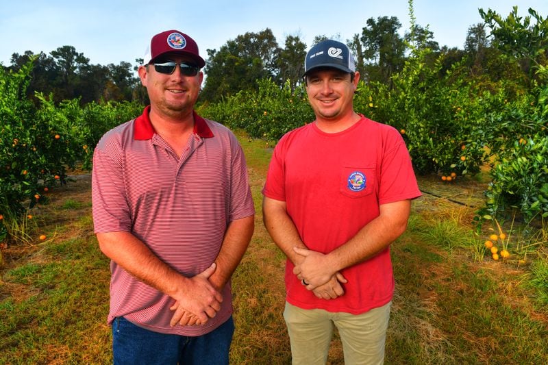Brothers Justin Corbett (left) and Jared Corbett took over operations of Corbett Brothers Farms in 2019 when their father, Ken Corbett, retired. Contributed by Chris Hunt 