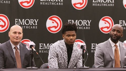 Atlanta Hawks General Manager Travis Schlenk (left), Hawks 2019 draft pick Cam Reddish (middle) and Atlanta Hawks Coach Lloyd Pierce (right) prepare to answer questions at Cam Reddish's introductory press conference at the Hawks practice facility, in the Emory Sports Medicine Complex, in Brookhaven, Georgia on Monday June 24, 2019. Reddish was selected by the Atlanta Hawks in the 2019 NBA Draft on  June 20, 2019, and was the 10th overall pick. Reddish previously played small forward/shooting guard for the Duke University Blue Devils. Christina Matacotta/CHRISTINA.MATACOTTA@AJC.COM