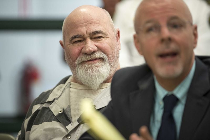 Frankie Gebhardt smiles as his lawyer, Larkin Lee, cross-examines a GBI investigator during a preliminary hearing in a Spalding County courtroom on November 30, 2017. 
