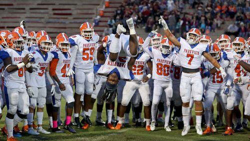 Parkview running back Gary Gamble (34) does a flip in front of his teammates before Friday's game. (Jason Getz/Special)